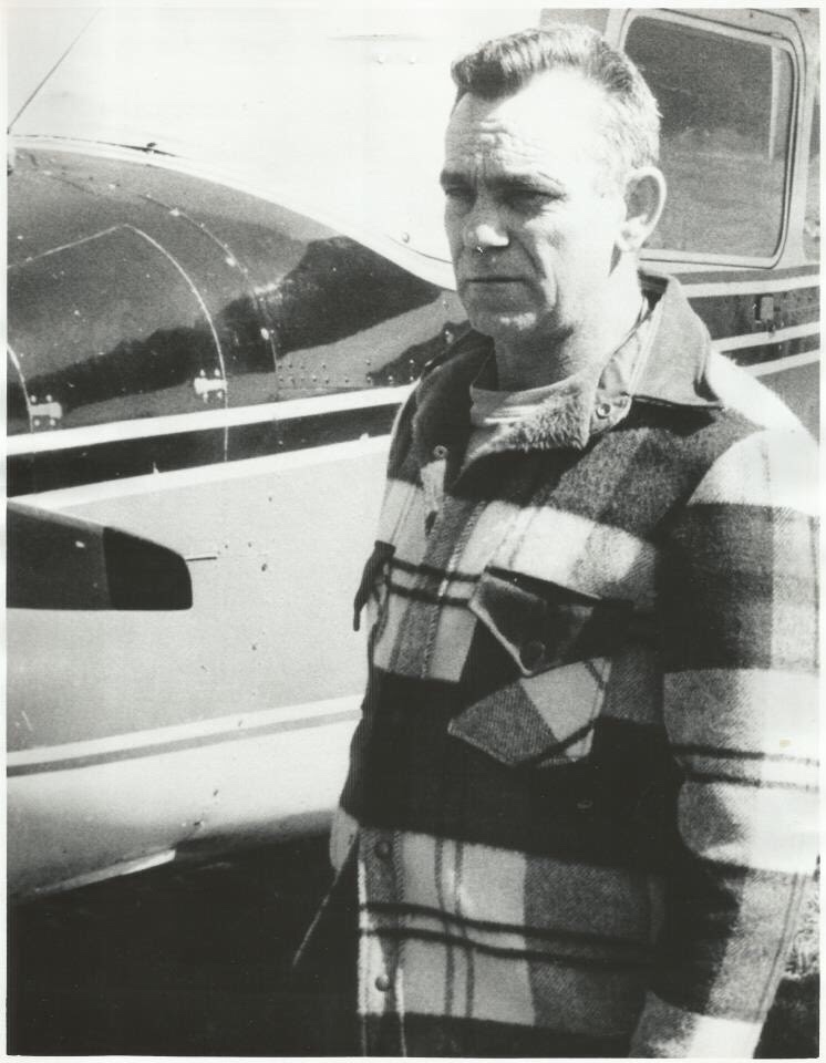 Howard Doland, the "Flying Farmer" stands next to his Cessna 172 at Slate Hill International Airport